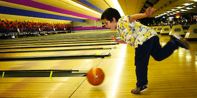 Kid playing bowling image